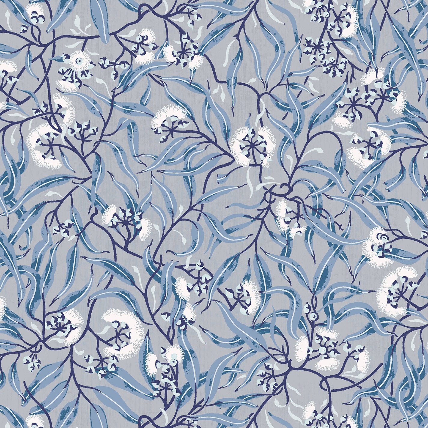 Wallpaper in a climbing vine floral design in tonal shades of blue and white. 