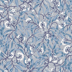 Wallpaper in a climbing vine floral design in tonal shades of blue and white. 