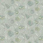 Wallpaper in a leave and bloom  design in yellow, green and cream against a taupe field. 