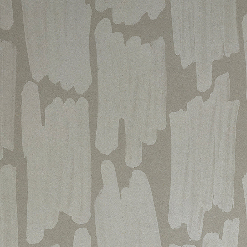 Detail of wallpaper in an abstract paint swatch print in light gray on a gray field.