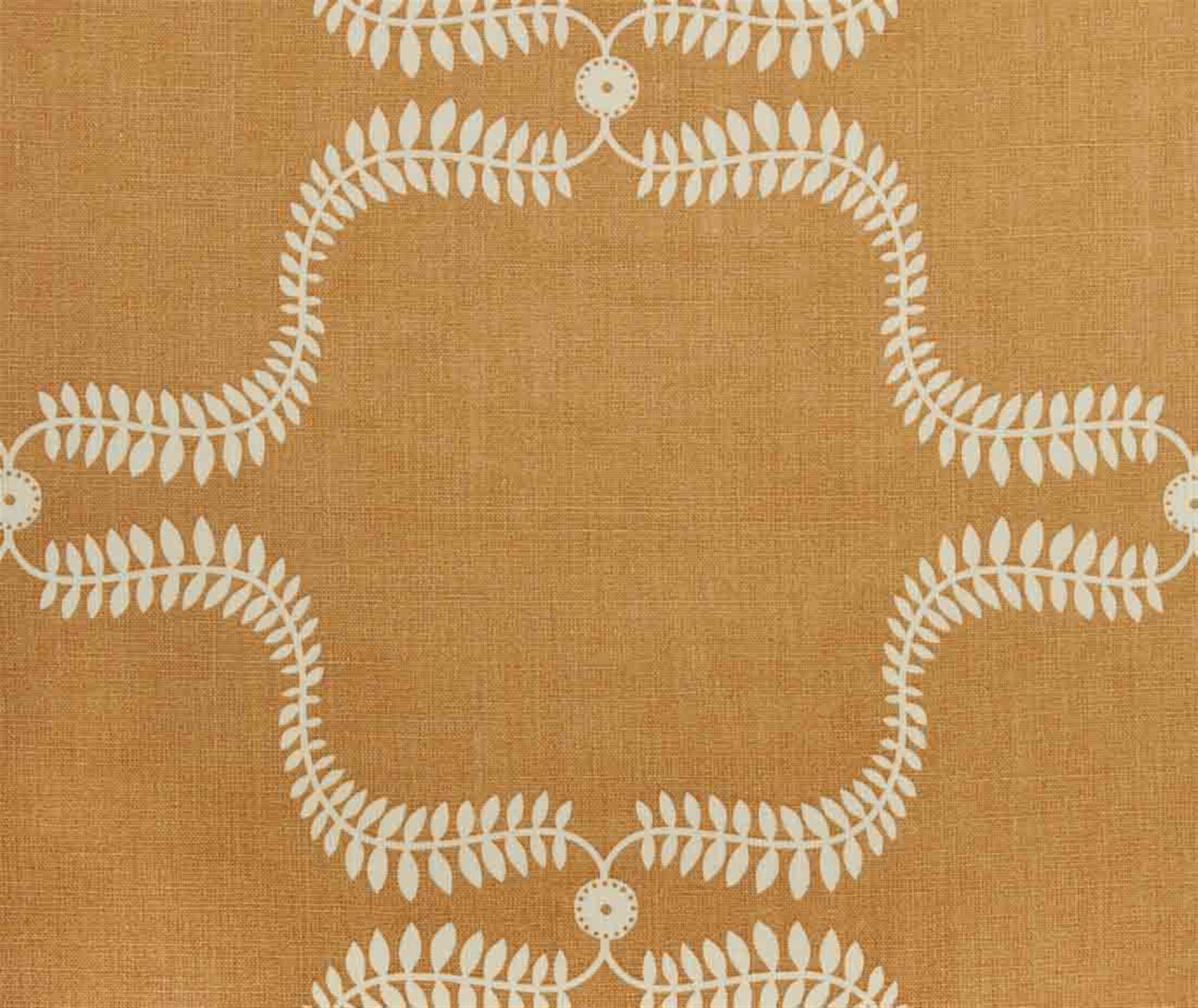 Detail of fabric in a leafy lattice print in cream on a burnt orange field.