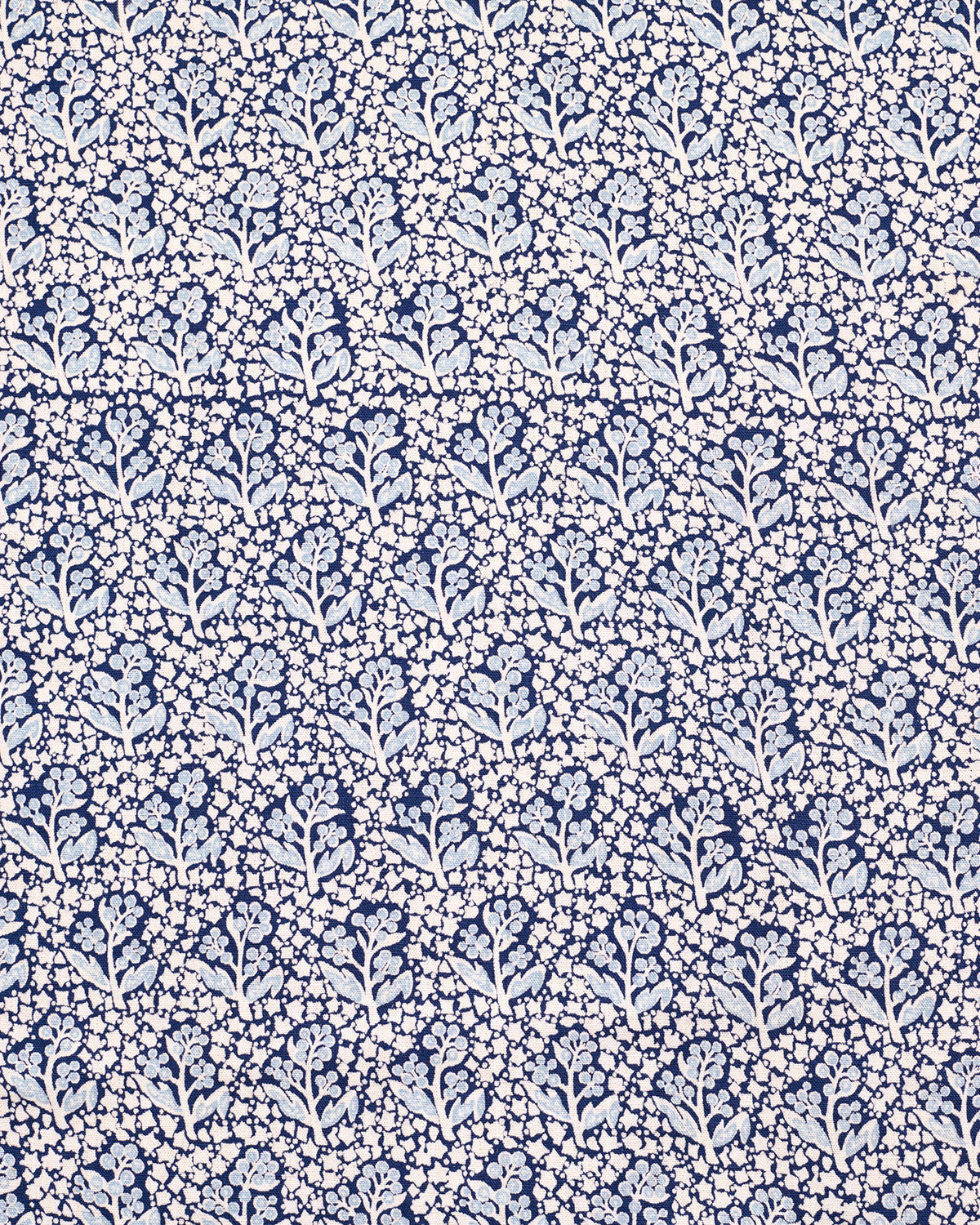 Navy blue fabric with a white floral pattern