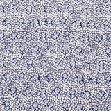 Navy blue fabric with a white floral pattern