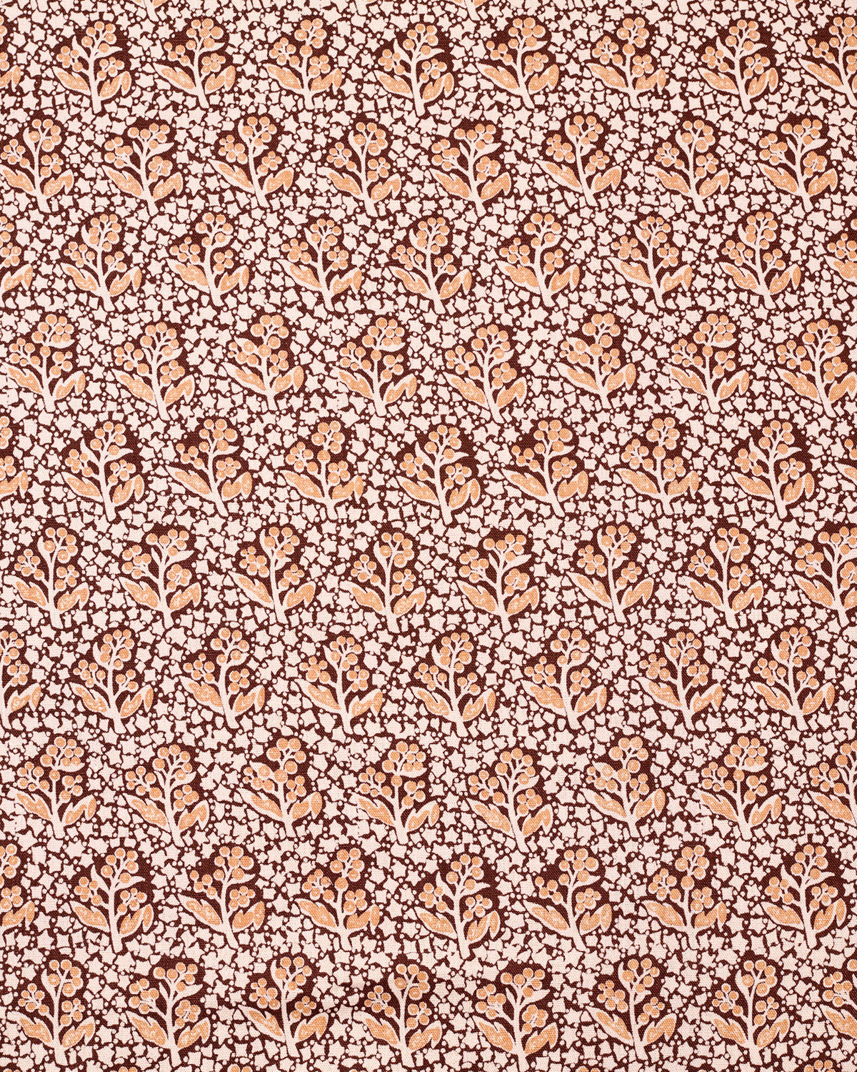 Patterned fabric with small floral design on a brown background