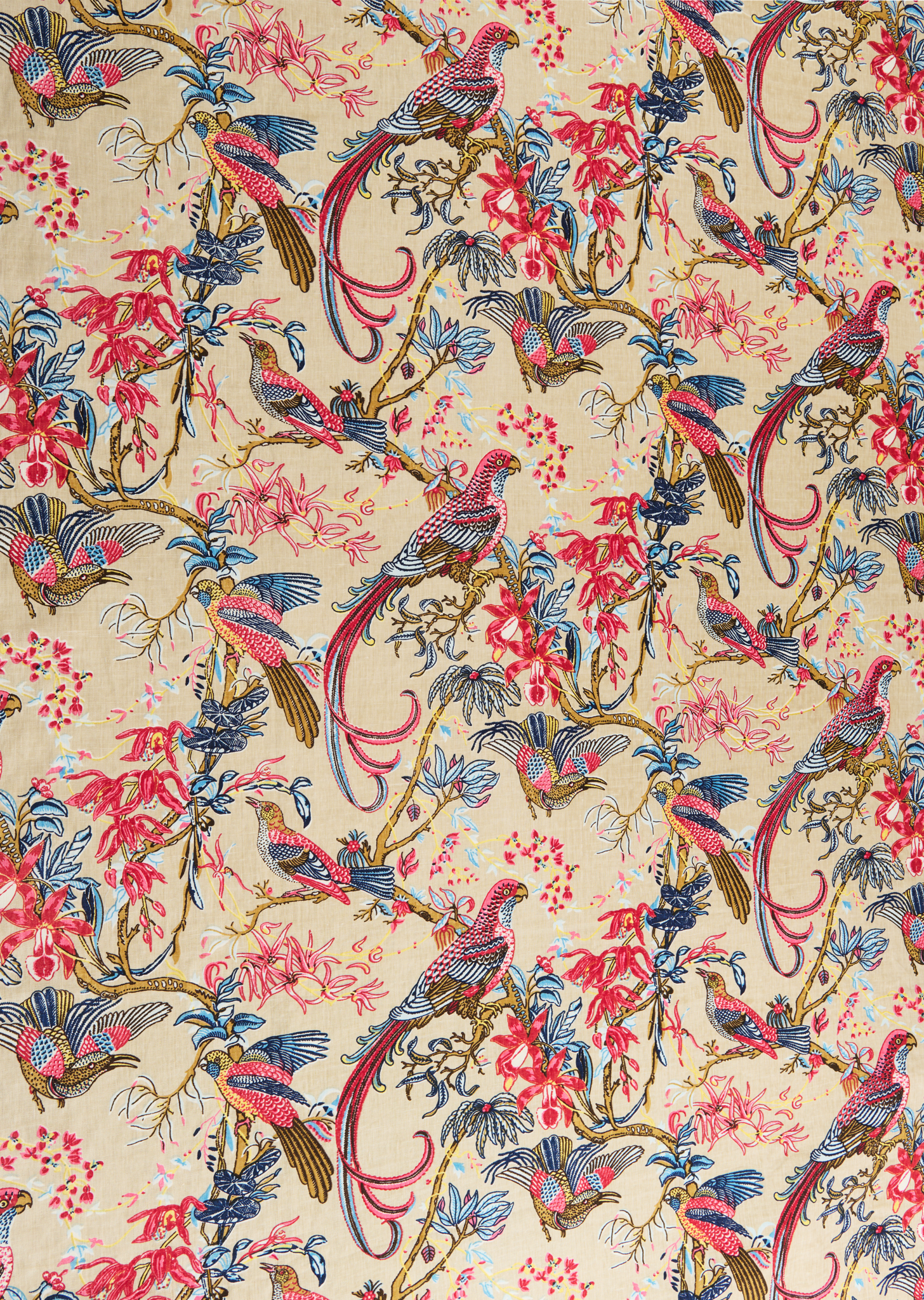 Printed fabric in a lyrical jungle design with tropical birds and leafy branches in pink, tan, blue and yellow on a beige field.