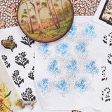 Collection of floral and nature-themed sketches on a floral patterned fabric