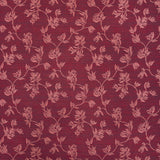 Performance fabric with a scrolling floral design in magenta pink 