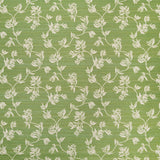 Performance fabric with a scrolling floral design in green. 