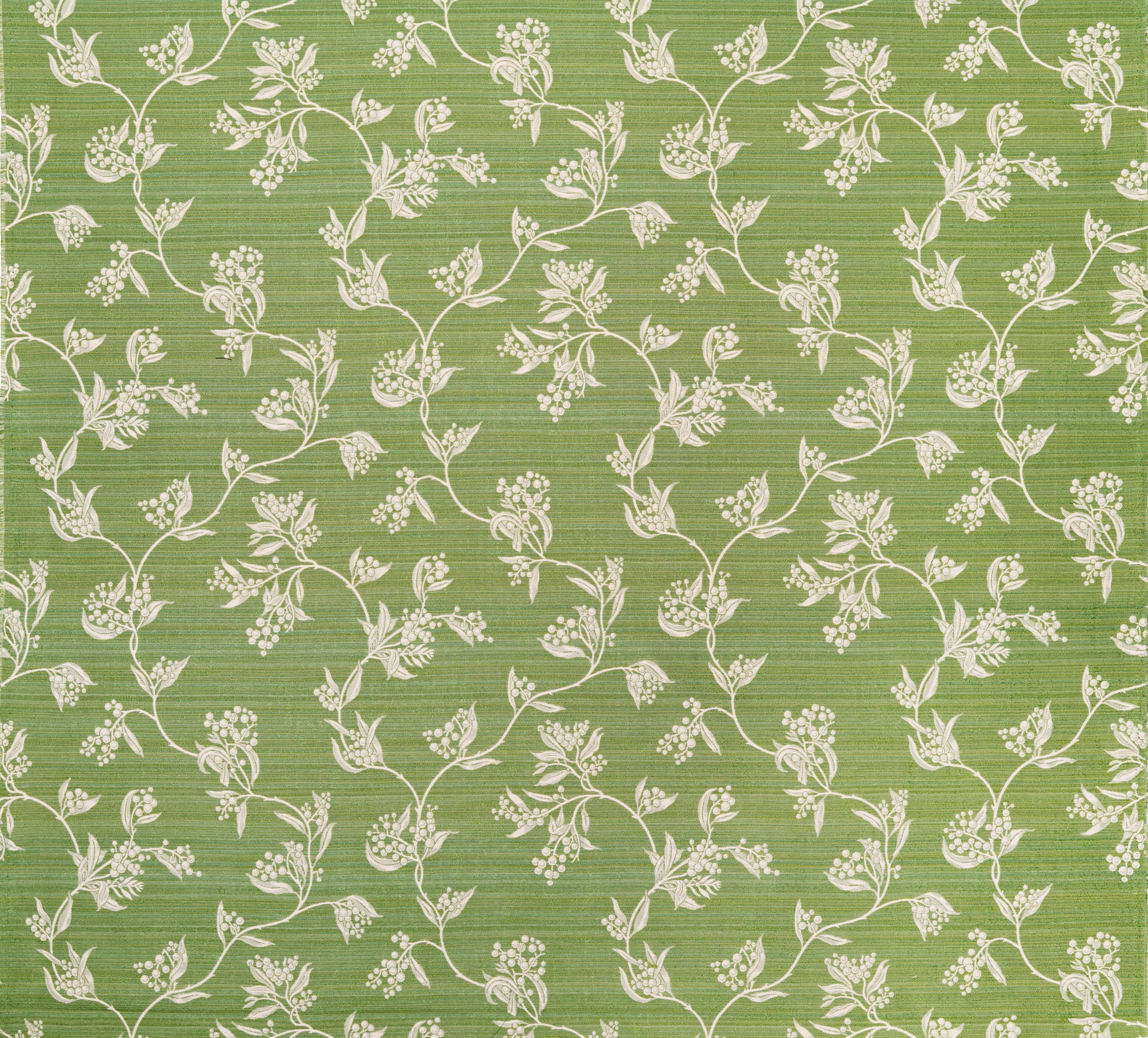 Performance fabric with a scrolling floral design in green. 