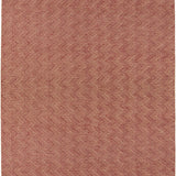 Red textured rug with a geometric pattern