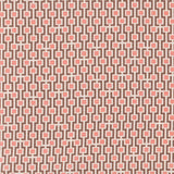 Fabric in a geometric grid print in shades of pink and brown on a tan field.