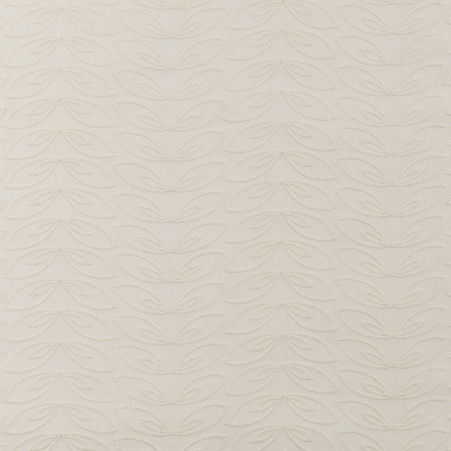 Fabric with an embroidered linear leaf print in cream on a cream field.