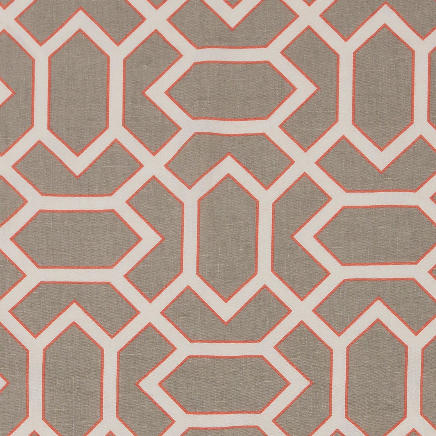 Fabric in a geometric lattice print in cream and coral on a tan field.