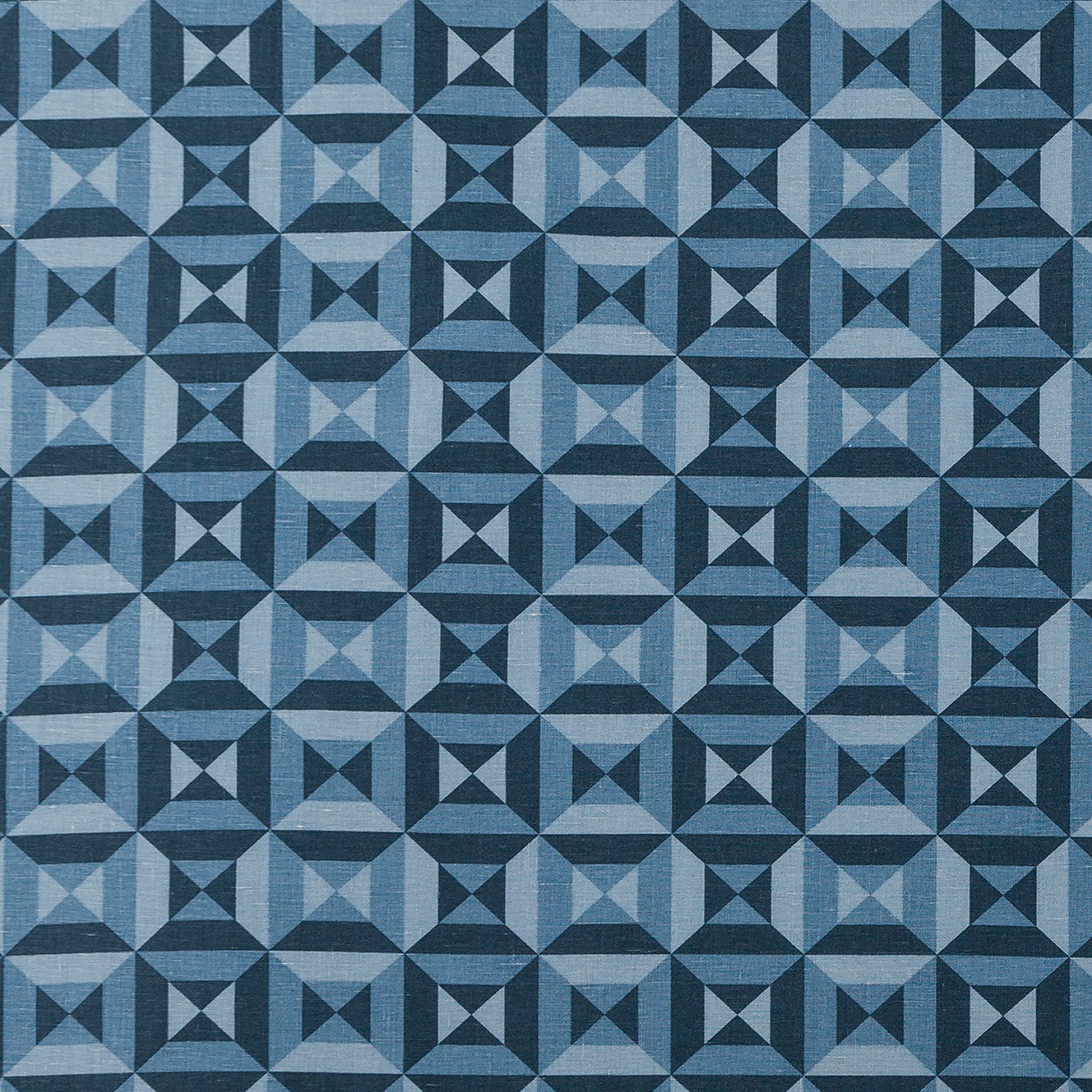 Fabric in a geometric grid print in shades of blue and navy.