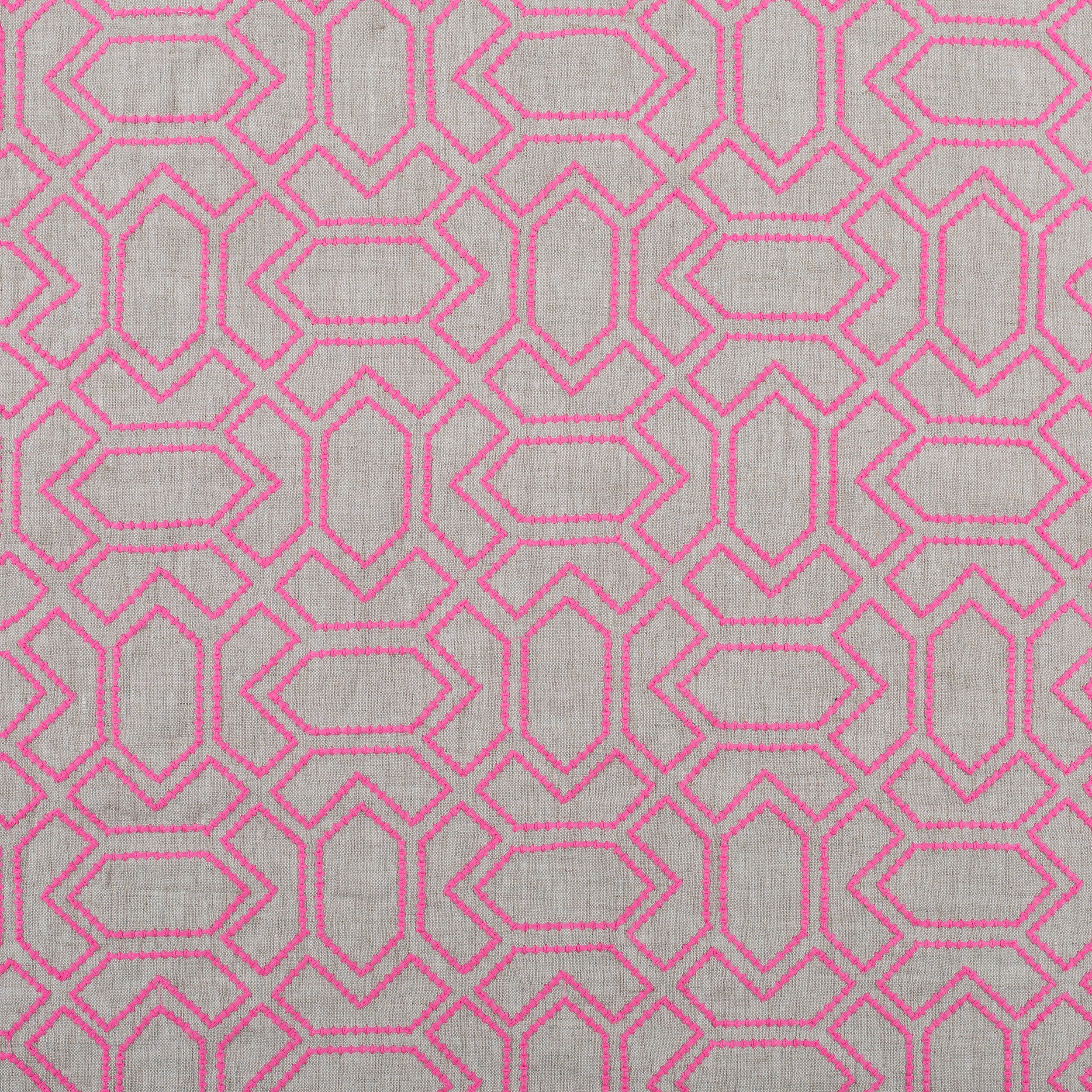 Fabric with an embroidered geometric grid print in pink on a gray field.