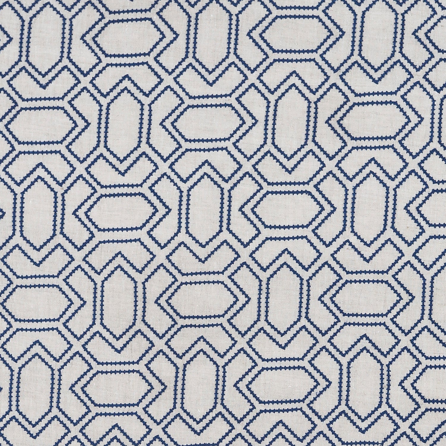 Fabric with an embroidered geometric grid print in navy on a light gray field.