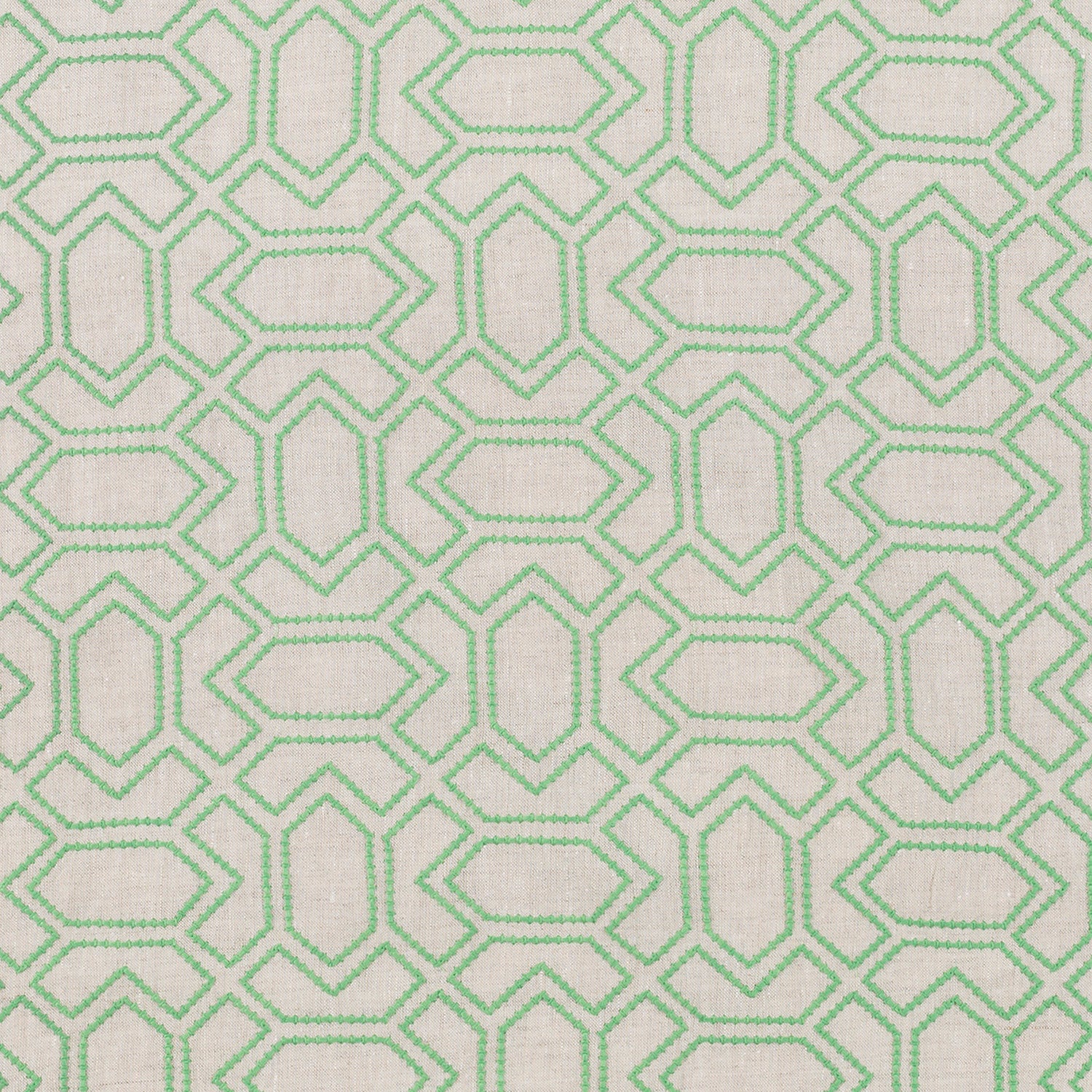 Fabric with an embroidered geometric grid print in light green on a light gray field.