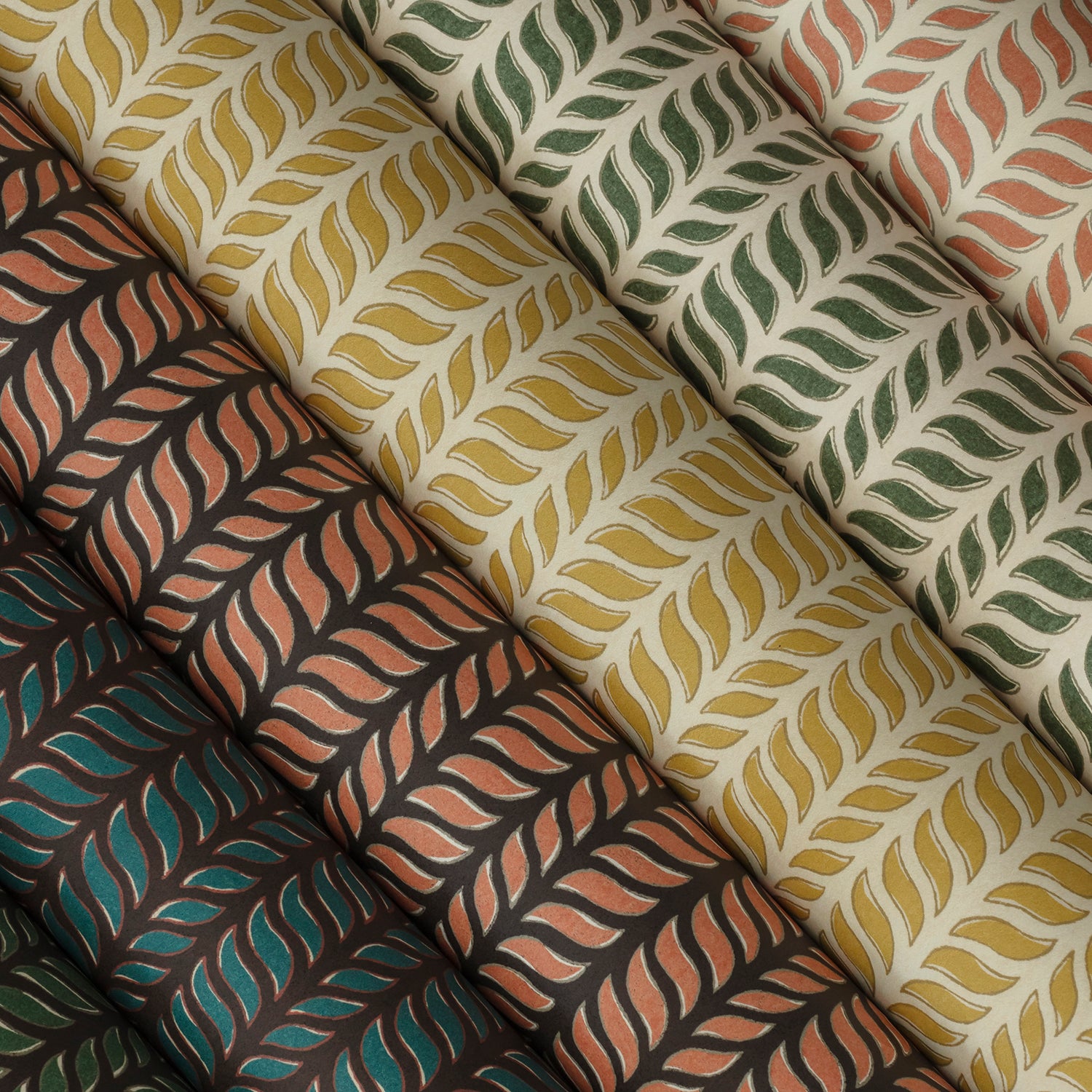 A close up shot of wallpaper rolls featuring a hand-painted chevron patterns. 