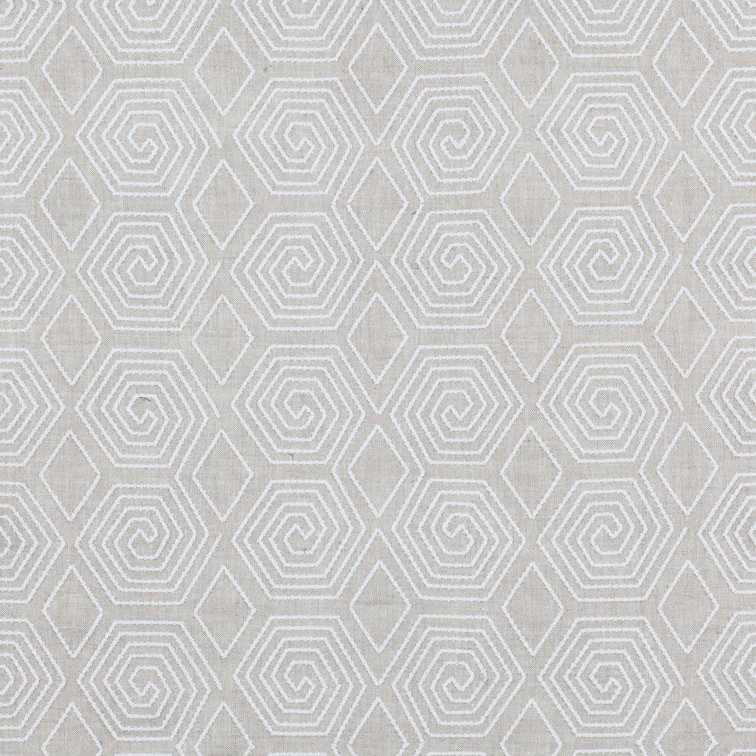 Fabric with a playful embroidered geometric grid print in white on a cream field.