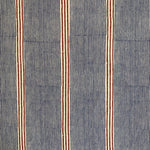 Detail of fabric in an irregular stripe print in navy and rust on a cream field.