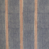 Detail of fabric in an irregular stripe print in navy and rust on a cream field.