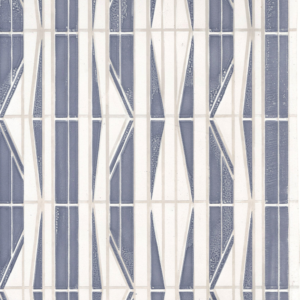 Detail of wallpaper in a geometric grid print in blue, cream and white.