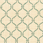 Detail of fabric in a curvilinear lattice print in green on a cream field.