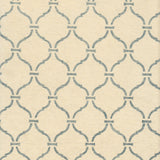 Detail of wallpaper in a curvilinear lattice print in blue-gray on a cream field.