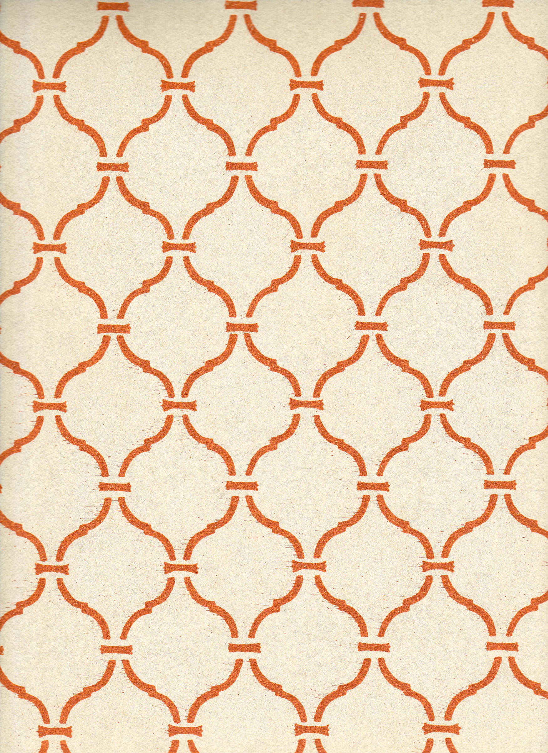 Detail of wallpaper in a curvilinear lattice print in orange on a cream field.