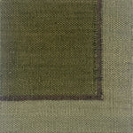 Close up of a flatweave rug in green with a brown and grey border. 