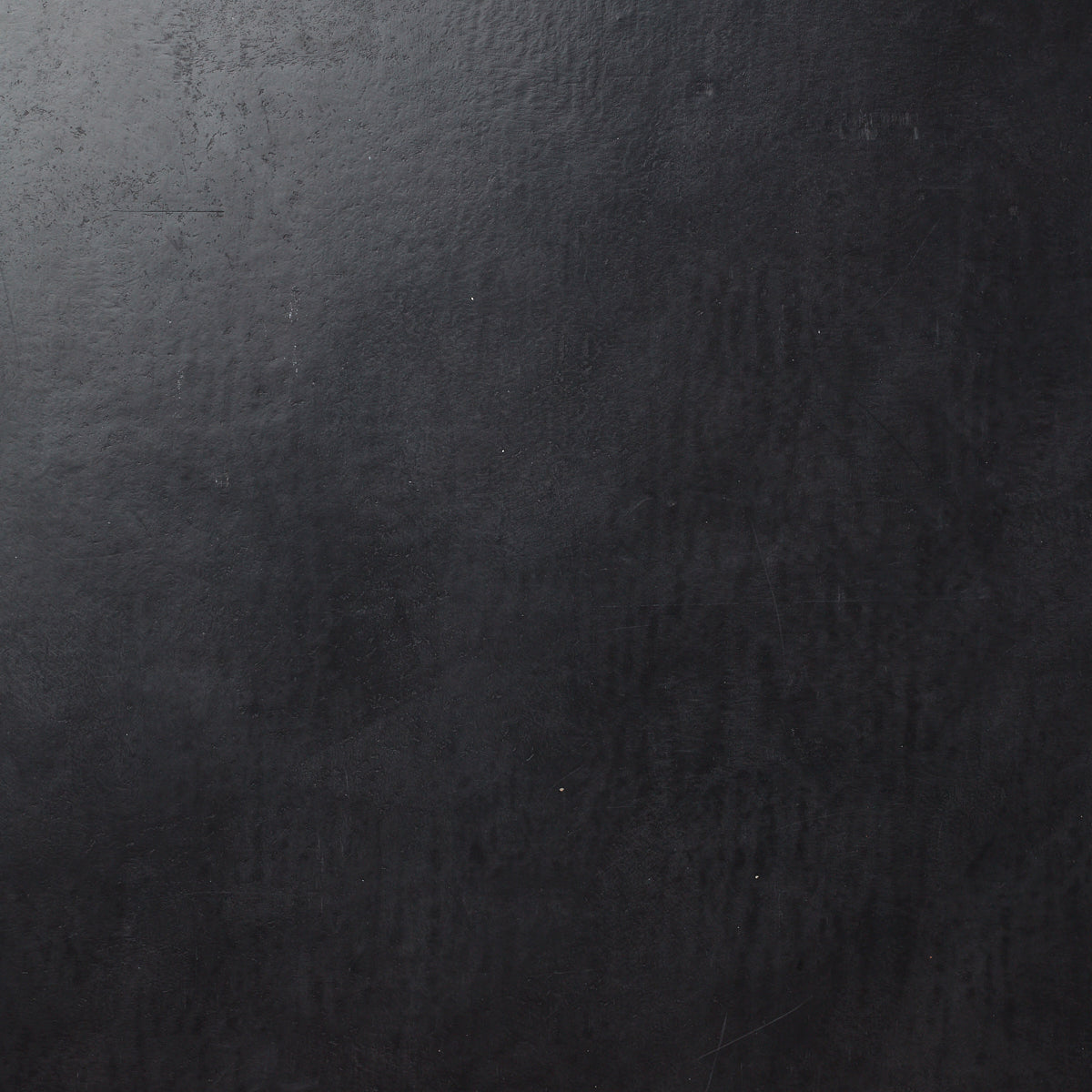 Detail of wallpaper in a glossy black leather.