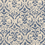 Detail of fabric in a botanical damask print in navy on a cream field.