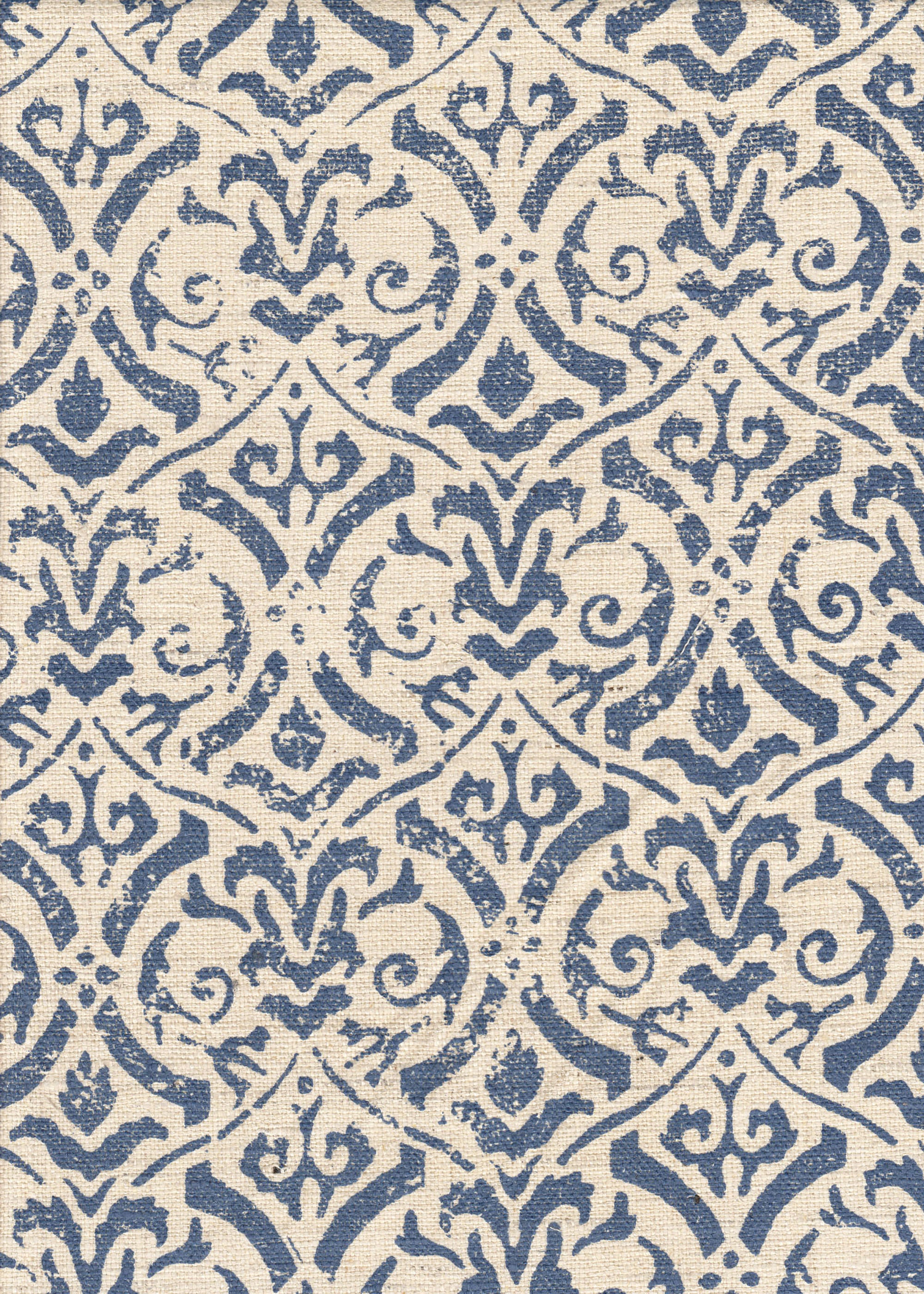 Detail of fabric in a botanical damask print in navy on a cream field.