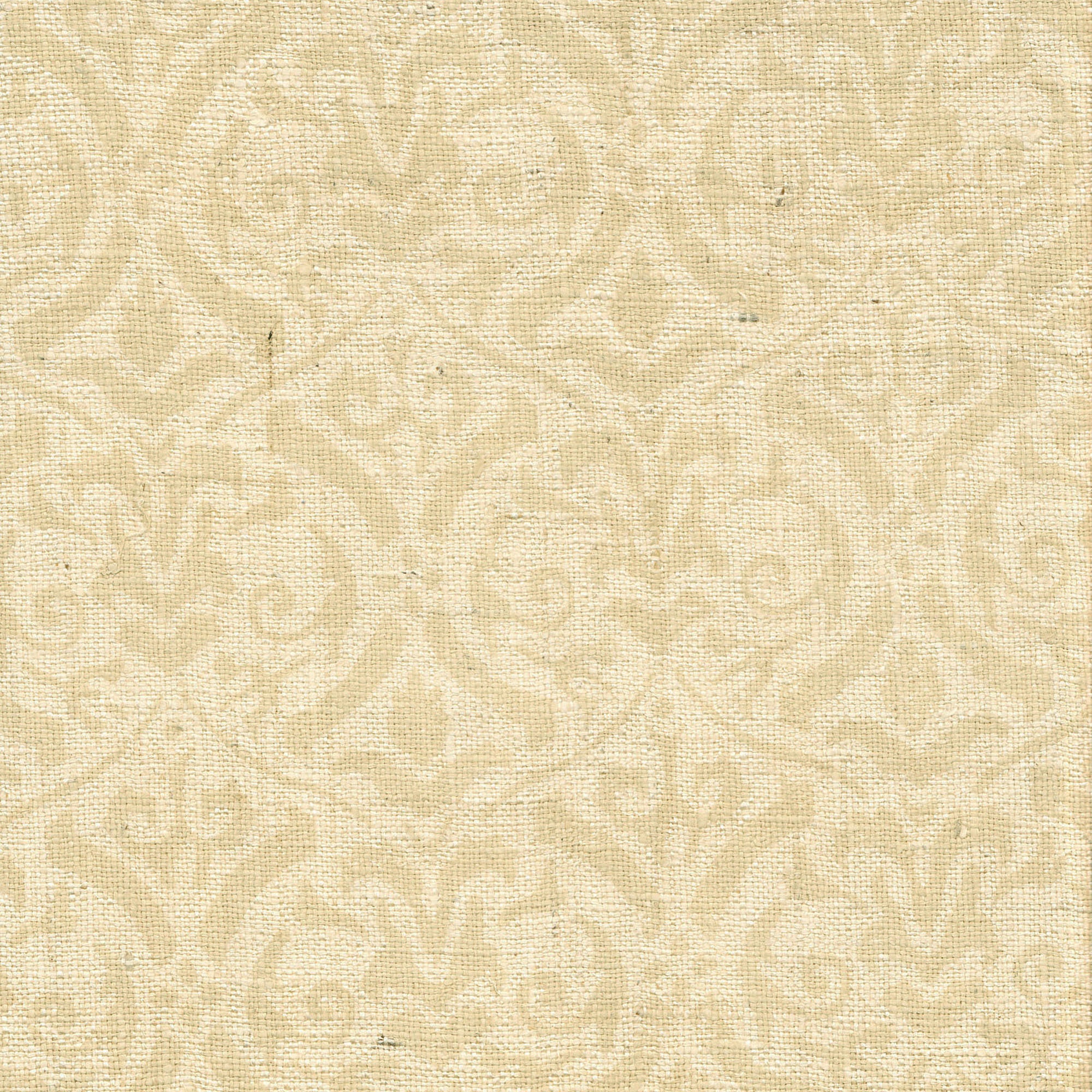 Detail of fabric in a botanical damask print in tan on a cream field.