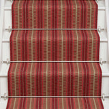 Striped flatweave runner in red and tan on white staircase