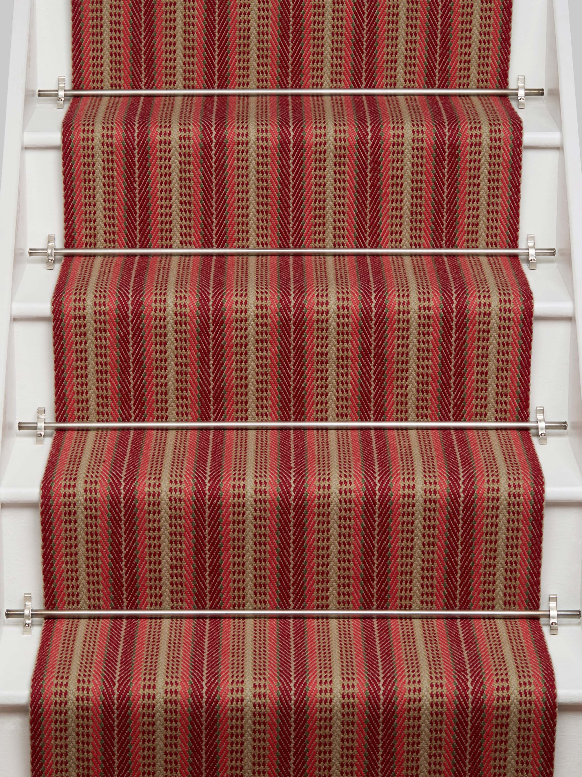 Striped flatweave runner in red and tan on white staircase