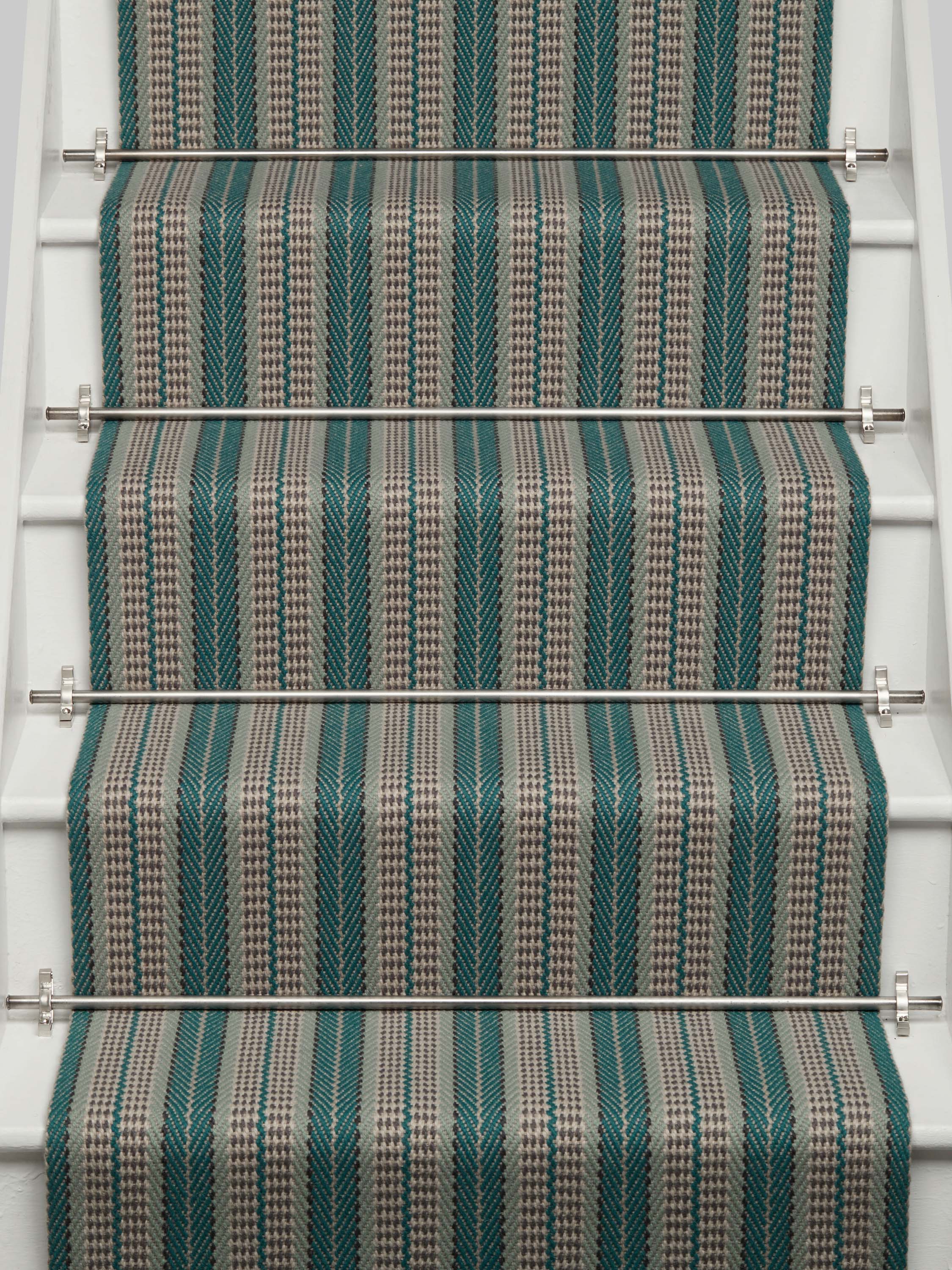 Striped flatweave runner in blue and grey on white staircase