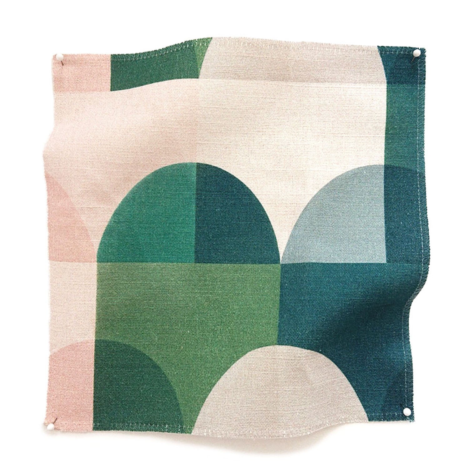 Square fabric swatch in a curvy geometric print in shades of green, cream, pink and gray.