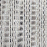 Broadloom carpet in dashed stripe pattern in shades of brown and grey with cream. 