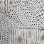 Broadloom carpet samples in a stripe pattern in a range of neutral colors. 