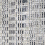 Broadloom carpet in dashed stripe pattern in shades of blue and grey with cream. 