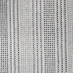 Broadloom carpet in dashed stripe pattern in shades of dark blue and grey with cream. 