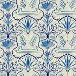 Detail of wallpaper in an intricate floral lattice print in shades of blue on a cream field.