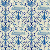 Detail of wallpaper in an intricate floral lattice print in shades of blue on a cream field.