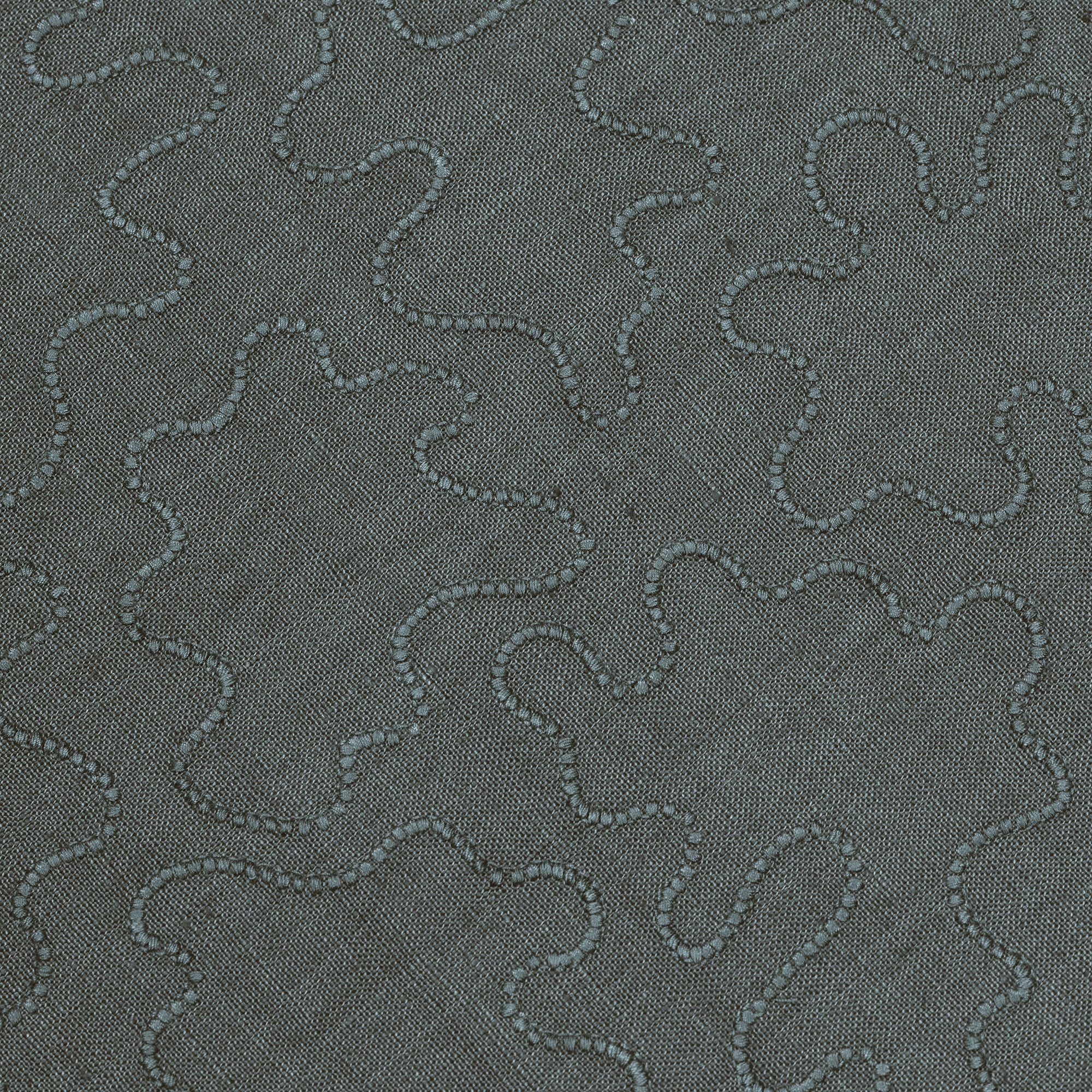 Fabric with an abstract embroidered pattern in gray on a gray field.