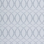 Wallpaper in a playful floral lattice print in navy blue and tan on a white field.