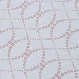 Detail of a wallpaper in a playful floral lattice print in tan and rust red on a white field.