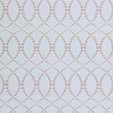 Wallpaper in a playful floral lattice print in tan and rust red on a white field.