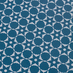 Wallpaper detail in a floral lattice print in cream on a indigo blue field.