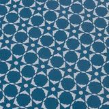 Wallpaper detail in a floral lattice print in cream on a indigo blue field.